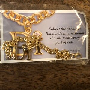 DIAMOND INTERNATIONAL gold charm bracelet